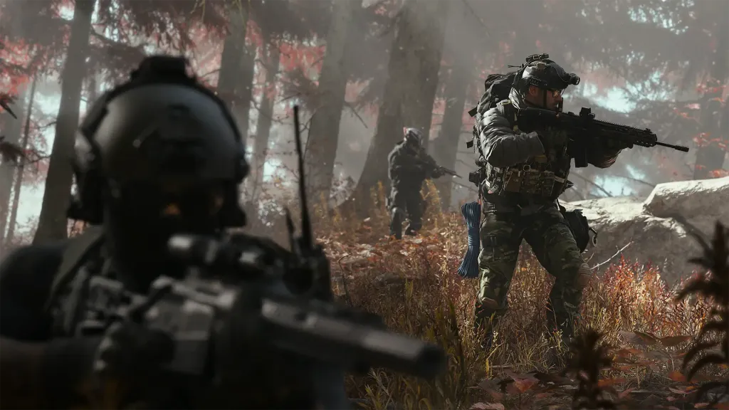 Operators moving through a sunlit forest with rifles raised